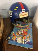 A Giants American Football helmet and two programmes