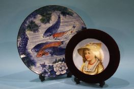 A pair of framed Continental plates and a pair of decorative 'Carp' plates