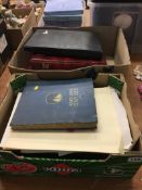 Two boxes of ephemera, stamp albums etc.