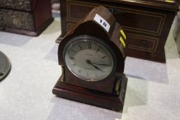 A mahogany mantle clock