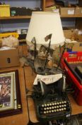 Typewriter, table lamp and model ship