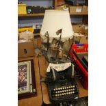 Typewriter, table lamp and model ship