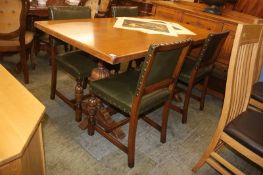 An oak sideboard, refectory table and four chairs
