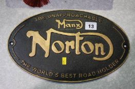 A cast Norton sign
