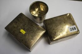 Two silver cigarette boxes and a cup
