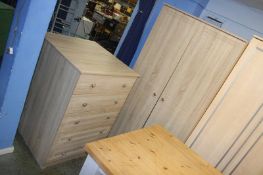 Two chest of drawers and a wardrobe
