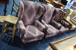 A pair of purple Parker Knoll armchairs