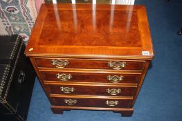 A reproduction mahogany chest of drawers