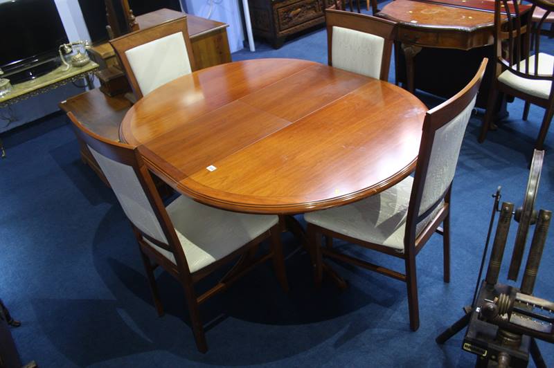 Oval extending dining table and four chairs