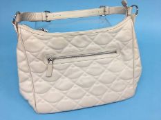 Large cream shoulder bag with quilted lips design from Lulu Guinness