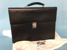 A Mont Blanc black leather brief case, with dust bag