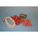 Four coral necklaces and a yellow metal and coral bracelet etc.
