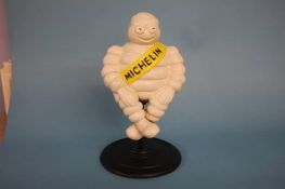 A cast Michelin man figure