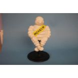 A cast Michelin man figure