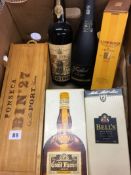 A box containing a bottle of Glenmorangie, 35cl, Bells Special Reserve, 70cl, Grand Marnier, 70cl,