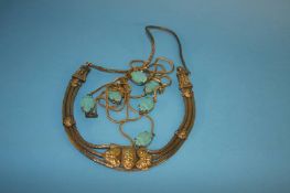 An Egyptian style necklace and a long yellow metal necklace, set with turquoise emblems (2)