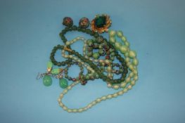 A jade necklace, two other necklaces, a brooch and three pairs of earrings
