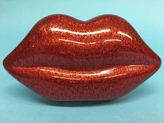 Red Perspex ‘Lips’ clutch bag from Lulu Guinness