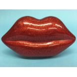 Red Perspex ‘Lips’ clutch bag from Lulu Guinness