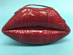 Raspberry snakeskin leather ‘Lips’ clutch bag from Lulu Guinness Couture, with dust bag