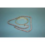 A 9ct gold diamond sprinkled bracelet, total weight 3.5 grams and a 925 silver necklace