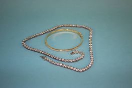 A 9ct gold diamond sprinkled bracelet, total weight 3.5 grams and a 925 silver necklace
