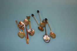 Three enamelled coffee bean spoons and five various enamel spoons