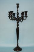 A black coloured six branch candelabra