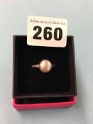 An 18ct white gold ring, mounted with diamonds and a small pearl, size 'N', 5.5 grams