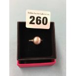 An 18ct white gold ring, mounted with diamonds and a small pearl, size 'N', 5.5 grams