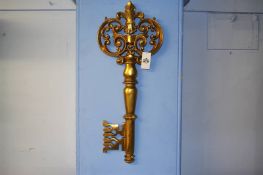 A large gilded composite wall hanging decorative key