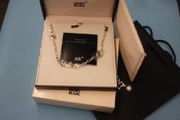 A boxed Mont Blanc 'Reveal Your Secrets' necklace un-worn and as new, with bag and booklet