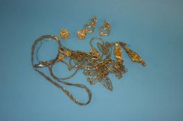 Four yellow metal necklaces and four pairs of earrings
