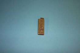 A 9ct gold ingot pendant, weight 30.3 grams