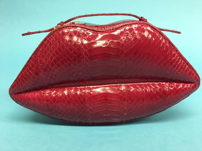 Raspberry snakeskin leather ‘Lips’ clutch bag from Lulu Guinness, with dust bag