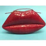 Raspberry snakeskin leather ‘Lips’ clutch bag from Lulu Guinness, with dust bag