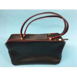 Black leather handbag with red trim, black and white stripe lining