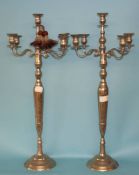 A pair of modern four branch silver coloured candelabra