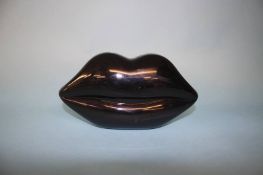 Black perspex Lips clutch bag from Lulu Guinness