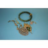 A Jade bangle, a heart shaped pendant, brooches etc.