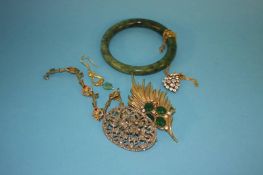 A Jade bangle, a heart shaped pendant, brooches etc.