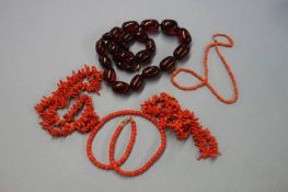 Amber coloured beads and a coral necklace