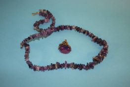 An Amethyst necklace, bracelet and a swivel fob