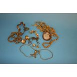 A Cameo brooch, five yellow metal necklaces, a bracelet and three pairs of earrings