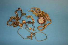 A Cameo brooch, five yellow metal necklaces, a bracelet and three pairs of earrings
