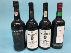 Two bottles of Warres 1980 port, 75cl, a bottle of Cockburns Special Reserve port, 75cl and a bottle