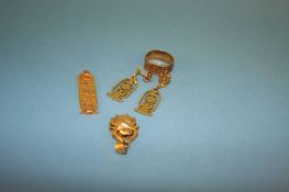 A quantity of yellow metal Egyptian design jewellery, weight 11.5 grams