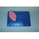 Dark Blue and Pink glitter pouch with cut-out lip from Lulu Guinness