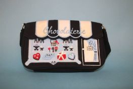 Black shoulder bag with Chocolaterie window front, with dust bag