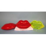 Neon Green Perspex Lips clutch bag from Lulu Guinness and two Red perspex Lips clutch bags, some